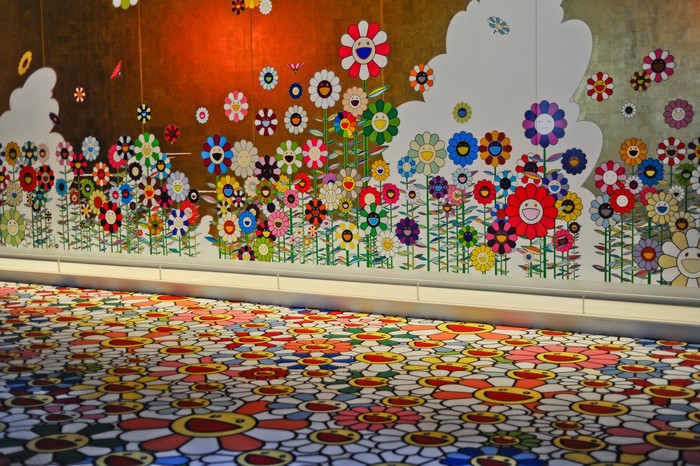 "Takashi Murakami is known for his contemporary Pop synthesis of fine art and popular culture, particularly his use of a boldly graphic and colorful anime and manga cartoon style."